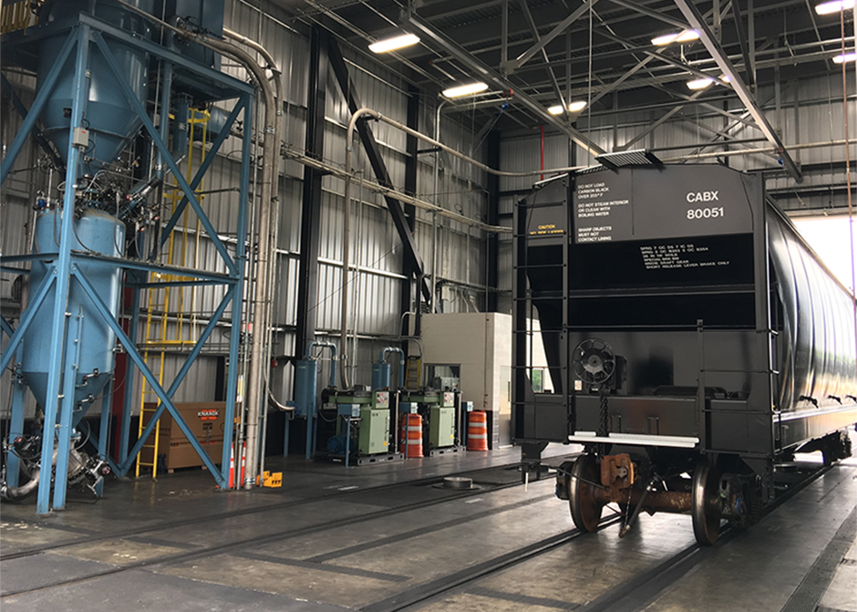 High density vacuum unloading of carbon black from railcars