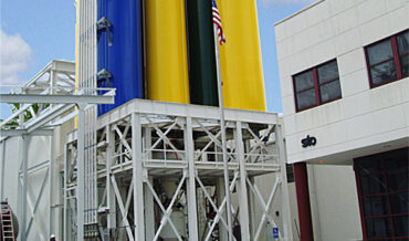 Weighing, batching and dense phase pneumatic conveying of synthetic stucco
