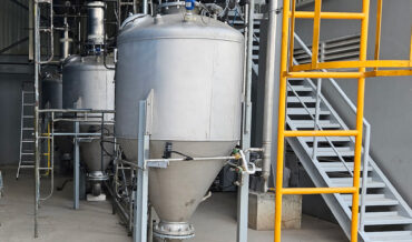 Multiple transporters for dense phase pneumatic conveying of granulated sugar